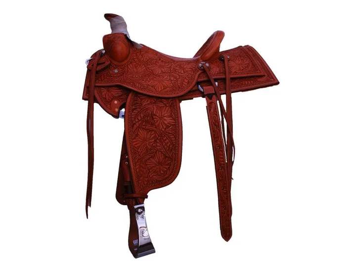 A tooled leather saddle with floral carving, made at Big Bend Saddlery.